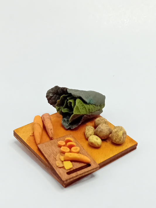 1:12 scale Polymer clay Green cabbage, carrot sand potatoes sat on a wooden chopping board placed on a 5cm x 5cm display board.