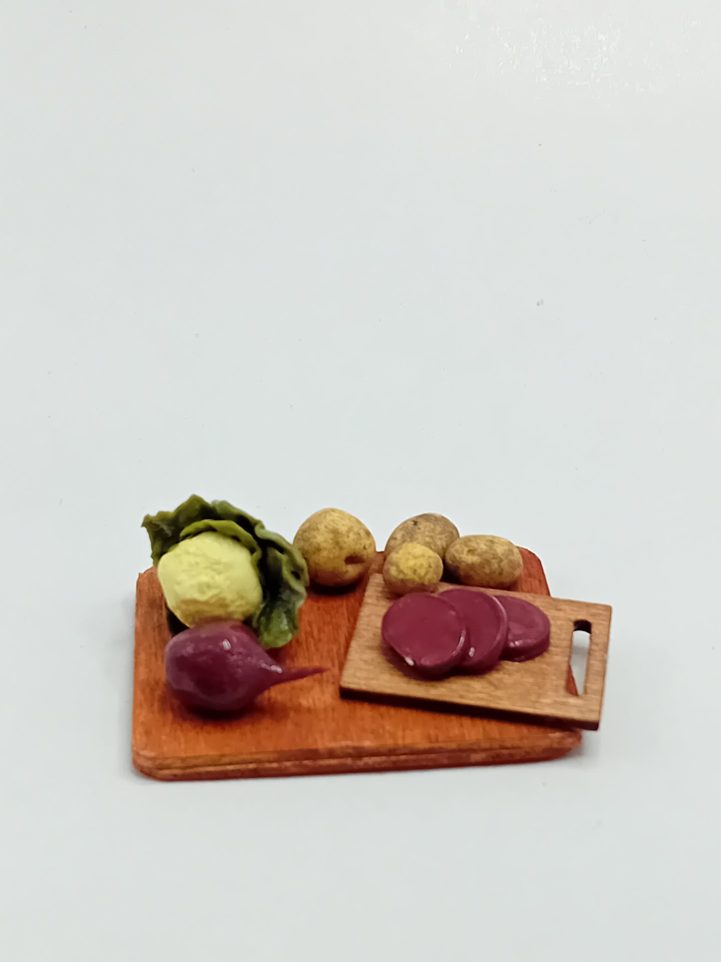 1:12 Scale polymer clay Cauliflower, beetroot and potatoes with chopping board on a wooden display board 5cm x 4cm.